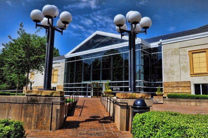 Daylight view of the main entry to a public building, one of Charlotte’s artistic treasures, ideal for anniversary ideas Charlotte NC.