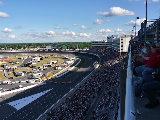 A crowd of people at the Charlotte Motor Speedway, a popular birthday party venue in Charlotte NC. This exciting race track is one of the best places to celebrate a birthday in Charlotte, offering a thrilling experience for all attendees.