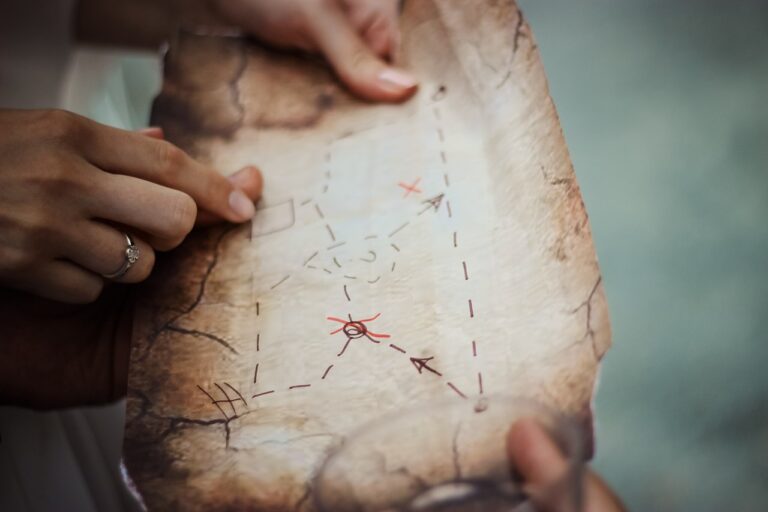 An image of a person holding a scavenger hunt map, ideal for creative birthday party ideas in Charlotte, NC. This activity can be part of outdoor or indoor birthday party ideas in Charlotte NC, offering an engaging and interactive experience for all ages.