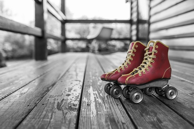 A pair of red retro roller skates on a black and white porch, expressing fun and nostalgic birthday ideas in Charlotte NC, for adults, perfect for a lively and memorable celebration.